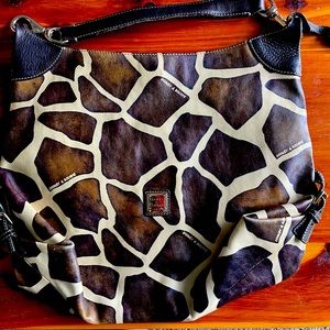 Dooney and Bourke giraffe print leather shoulder bag. Red inside.